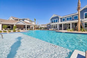 Resort style swimming pool with tanning ledge
